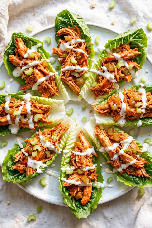 Buffalo rotisserie chicken lettuce wraps with ranch drizzle